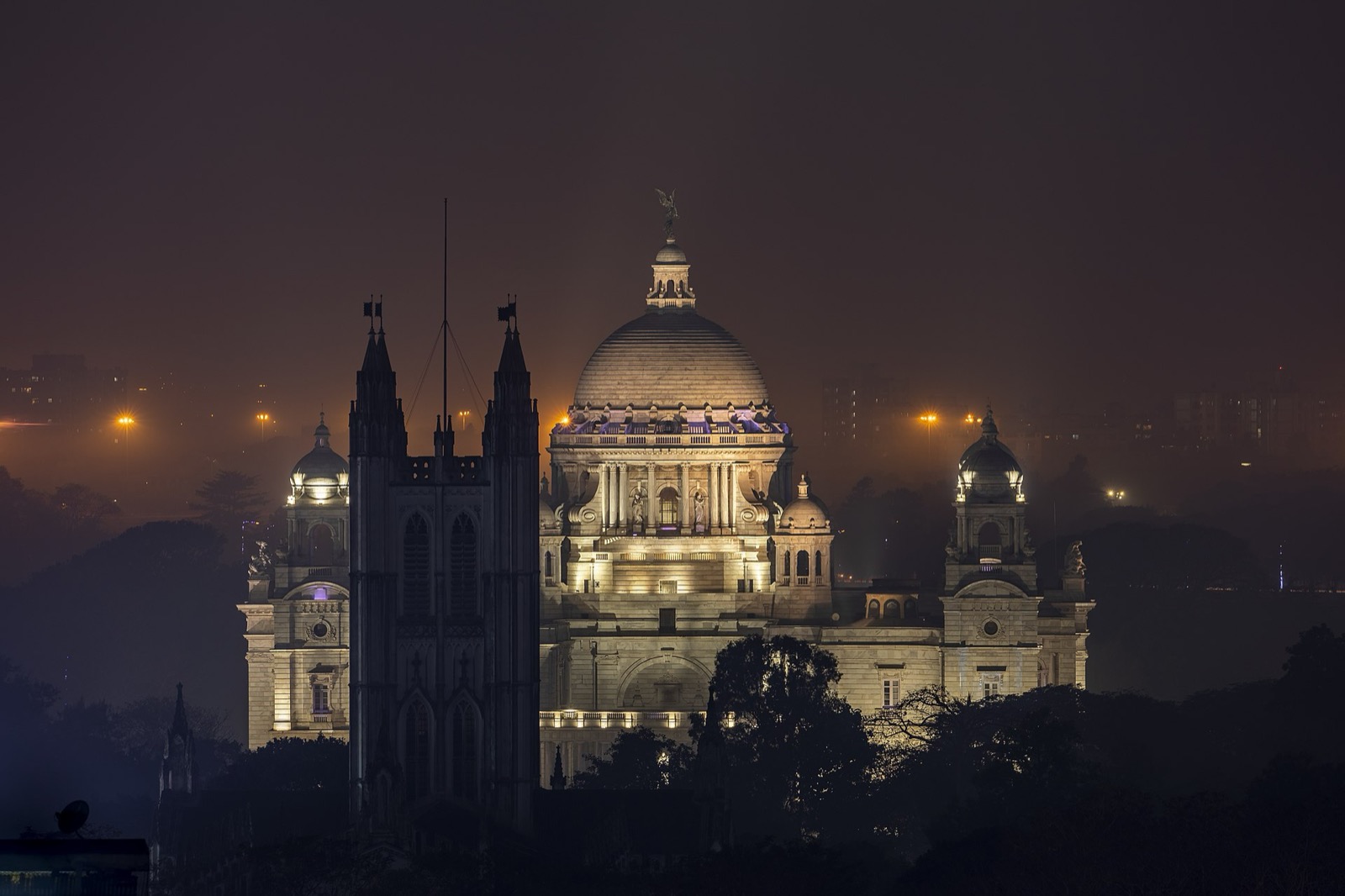 The Victoria Memorial lit at night.